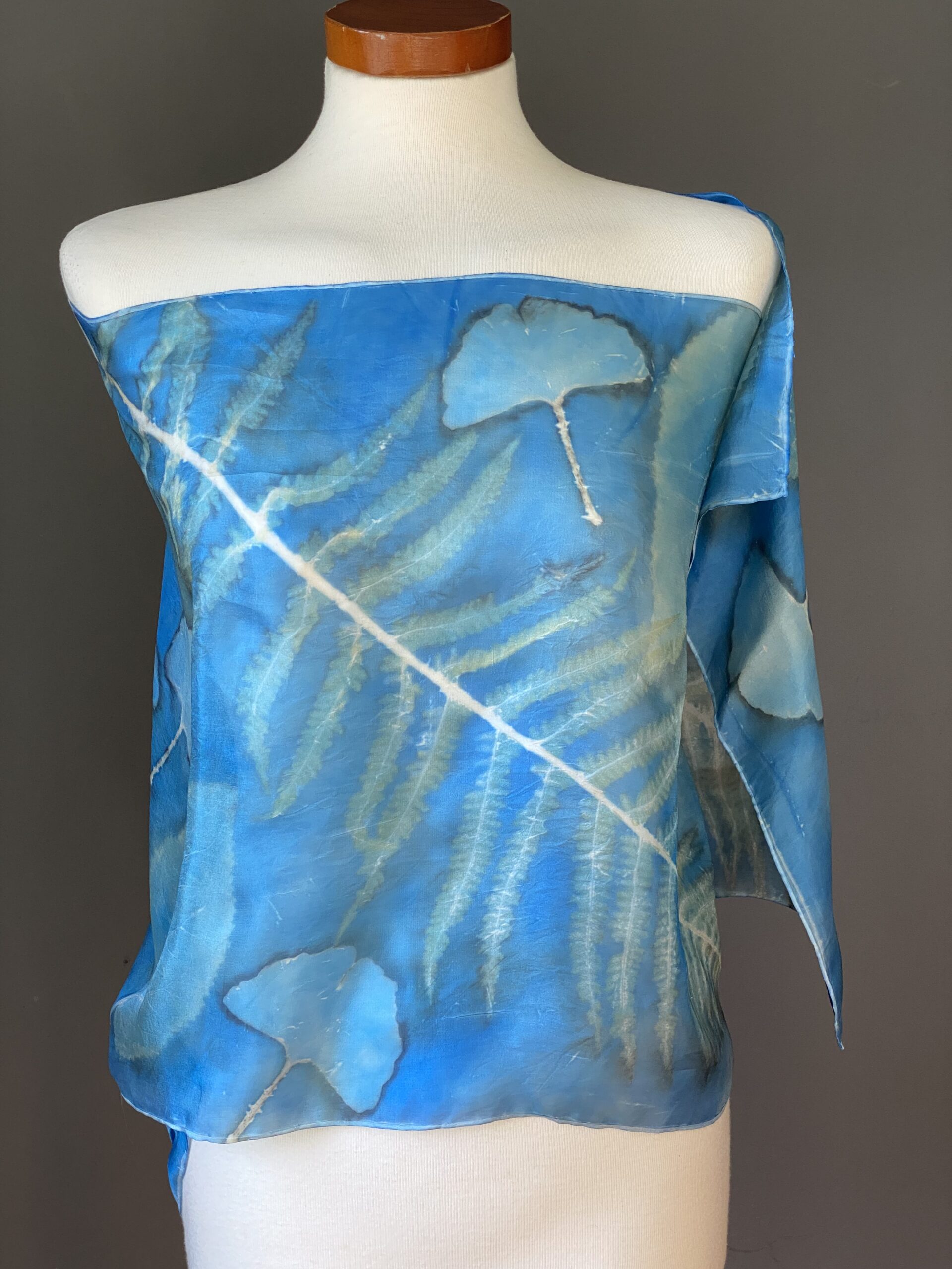 Falling leaves drift by my window